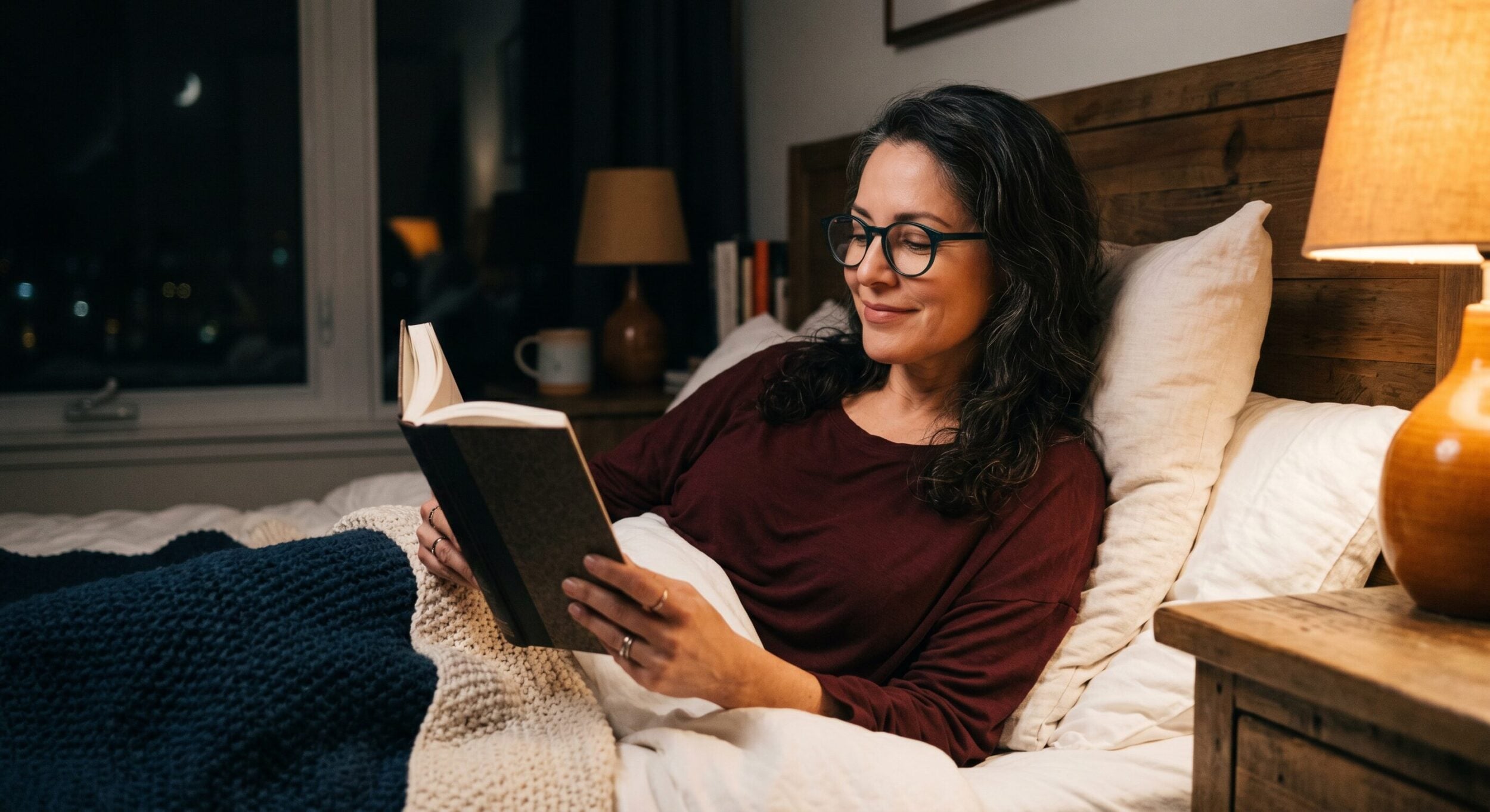 woman reading in bed mid 40s